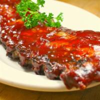 Pork Riblets · 1 pound of pork riblets decked with sweet and sour tamarind. Garnished with fresh basil and ...