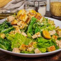 Chicken Caesar Salad · Chopped romaine tossed with Caesar dressing, grilled chicken, her bed croutons, and shaved P...