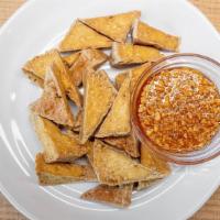 Fried Tofu · Fried tofu until perfect golden brown served with mild spicy sweet sauce.