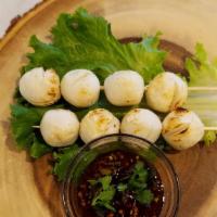 Grilled Fish-Balls ( 2 Skewers ) · Fish-balls perfectly grilled served with mild spicy tamarind dipping on the side.