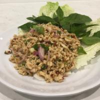 Larb Gai · Minced chicken, red onions, scallions and cilantro sprinkled with lime juice and exotic spic...