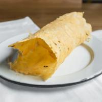 Chicharron De Queso · Thin crisp melted manchego cheese.