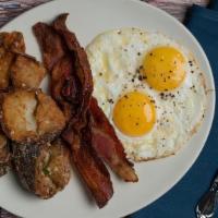 Traditional Breakfast · two eggs** any style with your choice of parmesan & rosemary potato cracklins* OR heirloom g...