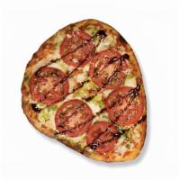 Margherita Naan Pizza · Pesto, tomato and balsamic glaze top our Naan Pizza made with signature red sauce and a mozz...