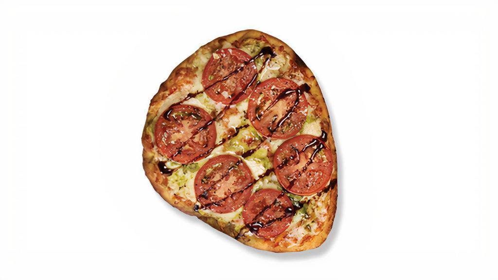 Margherita Naan Pizza · Pesto, tomato and balsamic glaze top our Naan Pizza made with signature red sauce and a mozzarella-provolone blend. 660 calories.