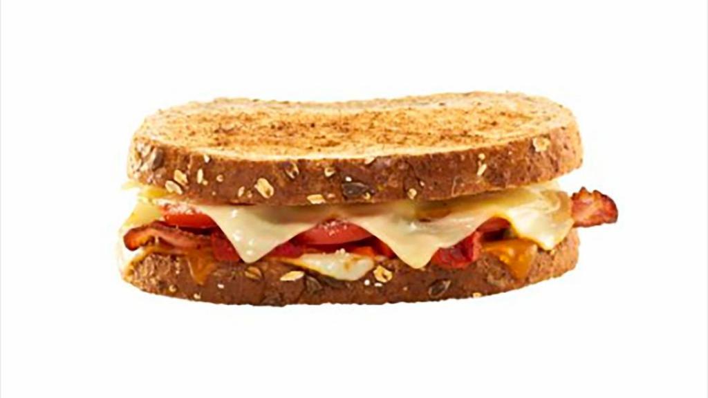 Bacon Grilled Cheese Sandwich · Cheddar, Swiss, Parmesan and Mozzarella/Provolone Blend cheeses with roasted red pepper, bacon, tomato, pesto aioli on toasted multi-grain bread.  780 calories.