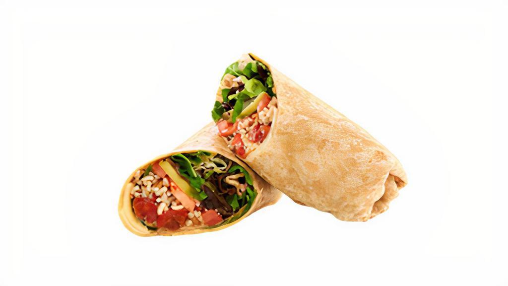 Avocado Grain Veggie Wrap · Ancient grain and kale blend topped with roasted peppers, caramelized onions, avocado, Swiss and our house made pesto aioli. 670 calories.