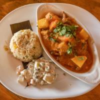 Carne Guisada (Latin Beef Stew) · Stewed beef chunks, with carrots and potatoes. Simmered in a Guatemalan creole tamato sauce....