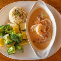 Camarones A La Crema · Sauteed Shrimp with garlic and onion simmered in a Guatemalan cream sauce with bell peppers....