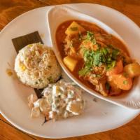 Hilachas (Guatemalan Beef Stew) · Shredded beef with potatos simmered in Guatemalan creole sauce, served with rice and ensalad...
