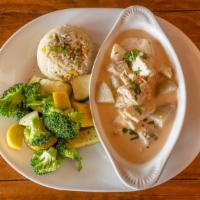 Pollo En Crema · Boneless chicken, with celery, red bell pepper, and potato in a flavorful Guatemalan cream s...