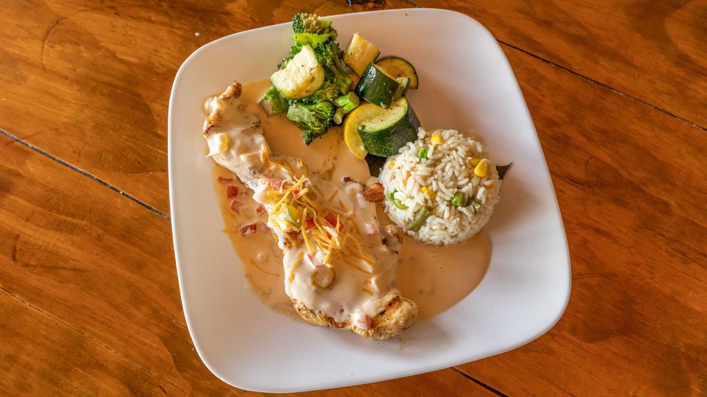 Marco'S Favorite · Grilled chicken breast topped with Guatemalan cream sauce, bell peppers, onions, mushrooms and cheddar jack cheese. Served with rice and mixed veggies.