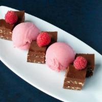 Chocolate Torte (V) · chocolate ganache with coconut milk, layered with toasted coconut and cashew, raspberry sorbet