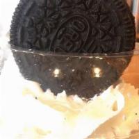 Oreo Crusher · Vanilla ice cream, crushed oreos, a flash of chocolate and whipped cream on top.