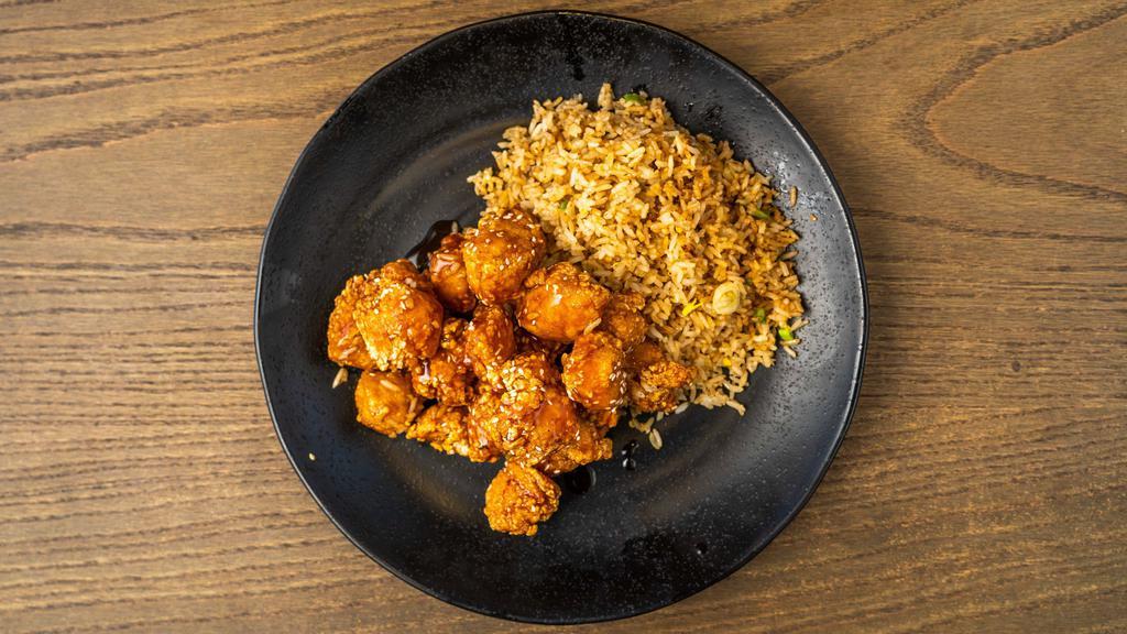 Sesame Chicken · This specialty plate is made with toasted sesame seeds, garlic, and our special wok-inn sauce. Served with steamed white or whole grain rice and soup.
