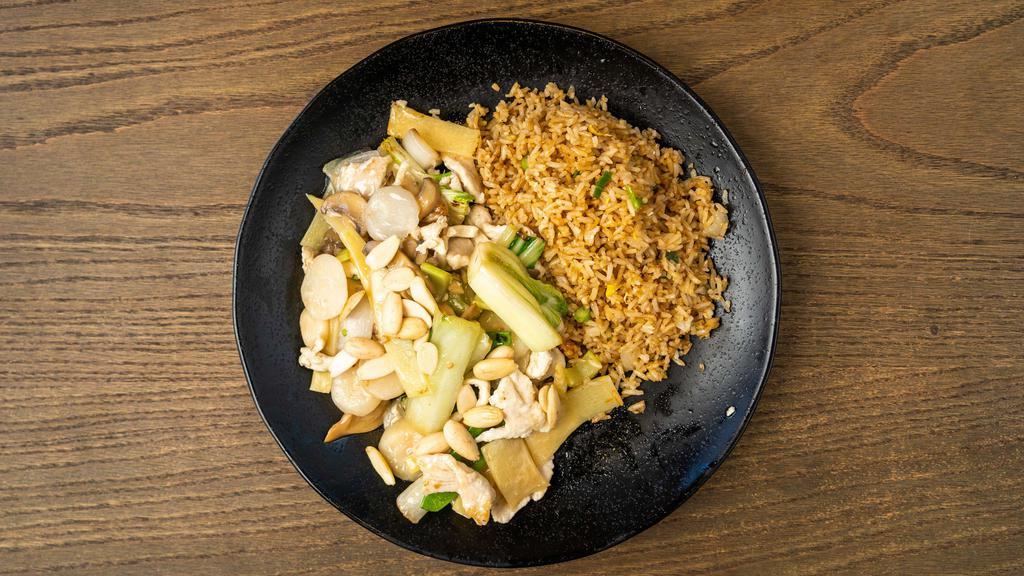 Almond Chicken · This specialty plate is made with bok choy, bamboo shoot, water chestnuts, celery, snow peas, mushrooms, garlic, onions, crispy almonds, wine sauce, and sesame oil. Served with steamed white or whole grain rice and soup.