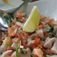 Manuel’S Classic Lime Cured Ceviche · Fresh yellow fin tuna cured in fresh lime juice an garnished with salsa fresca.