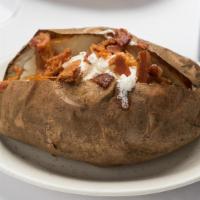 Jumbo Baked Potato · Salt-Crusted Baked Potato served with your choice of Cheese, Bacon, Butter Chives, & Sour Cr...