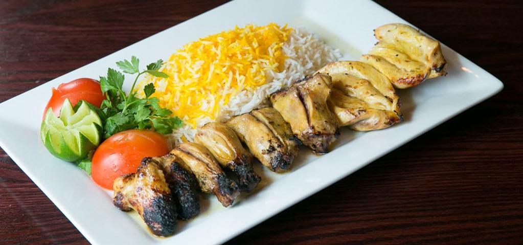 Cornish Hen Kabob · whole skinless cornish hen( Chicken with Bone ), marinated and charbroiled. Served with flame broiled tomato & basmati saffron rice.