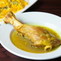 Lamb  Shank With Mixed Rice · Saffron rice mixed with Fresh Fava beans and dill served with cooked Lamb shank