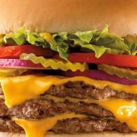 Triple-Buster® With Cheese · Three 1/4 lb patties and triple cheese, mustard, lettuce, tomatoes, pickle, and onions.
