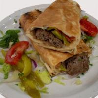 Ground Beef Kabob · Ground beef mixed with onion and salt, char-broiled and rolled whit onion and basil.
