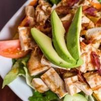 Grilled Chicken Salad · Bed of mixed greens with tomatoes, cucumbers, cheddar cheese, crouton, avocado, beef or chic...