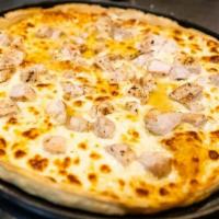 White Pizza · Alfredo covered with mozzarella and tender bits of marinated chicken breast.