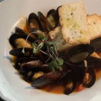 Cozze Marinara · Black mussels in our light tomato basil broth.