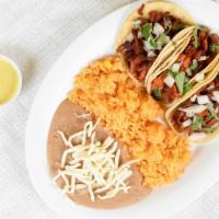 Taco Plate · Three corn tortilla  tacos, rice and beans.