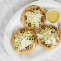 3 Sopes Con Carne · 3 sopes with choice of meat beans lettuce sour cream and cheese.