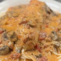 Ravioli Delicate · Sauteed with Roasted Peppers and Mushrooms in a Vodka Cream Sauce.