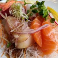 Sashimi Sampler · Two pieces of tuna, salmon, yellowtail sashimi.
