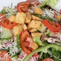 Italian Salad · Includes, crisy romaine and iceburg lettuce, fresh tomatoes, black and green olives, mushroo...