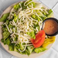 Small Salad · Crispy romaine and iceburg lettuce, fresh tomatoes, and pepperoncini. Garnished with mozzare...