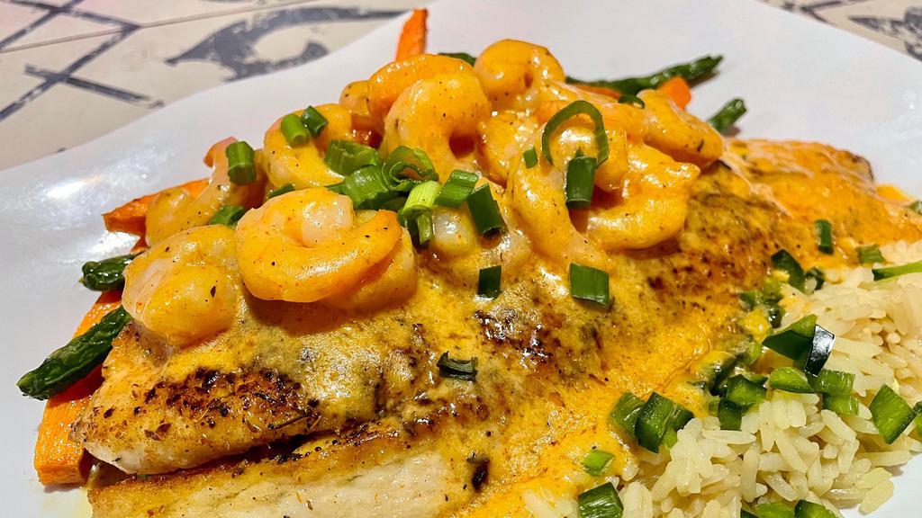 French Quarter Red Fish · broiled or blackened, topped with shrimp in a spicy cream sauce, with mixed veggies & poblano rice.