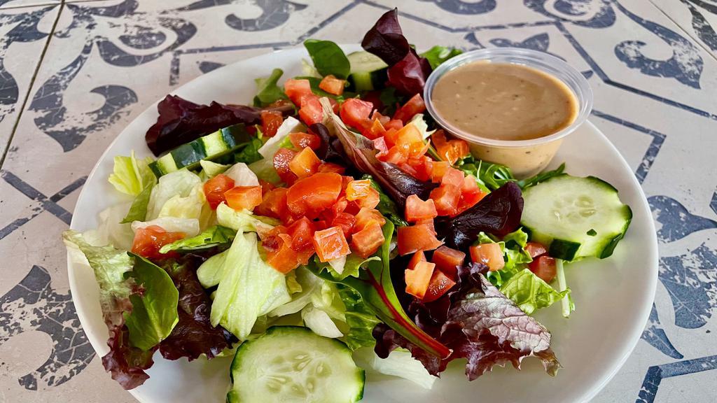 Side Salad · SMALL $6 or LARGE $9 mixed greens, tomatoes, cucumbers with choice of dressing: raspberry vinaigrette, balsamic vinaigrette, chipotle vinaigrette, blue-cheese or ranch.