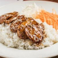 Teriyaki · Grilled protein with teriyaki sauce, toasted sesame seeds, preserved cabbage, and carrot on ...