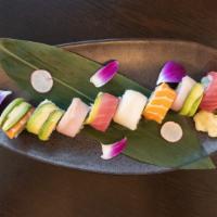 Rainbow Roll · Crab stick, avocado and cucumber inside with tuna, salmon, yellowtail, white fish and avocad...