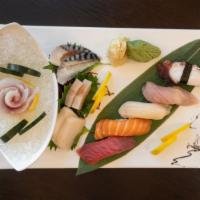 Sushi & Sashimi Combo · Five pieces of assorted sushi, 12 pieces of assorted sashimi with one tuna roll.