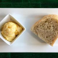 Sourdough Bread W/Butter · A chunk of delicious & warm sourdough bread, served with butter.