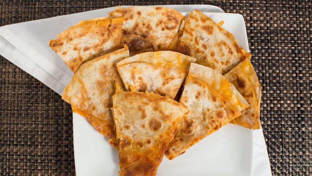 Breakfast Quesadilla Half · Eggs scrambled with your choice of meat. Served with a side of sour cream.