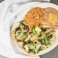 Tacos Juan · Three street style tacos with your choice of meat, topped with onion and cilantro. Comes wit...