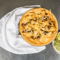 Nachos · Crispy tortilla chips topped with refried beans, your choice of meat, queso, and shredded ch...
