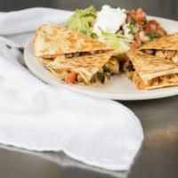 Kids Quesadilla · Cheese, chicken, or ham quesadilla served with French fries and a side of sour cream.