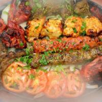 Mix Grill Platter · A combination of your favorite spicy kabobs consisting of beef & chicken seekh kabob, tandoo...