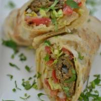 Beef Seekh Kabob Wrap · Minced beef marinated with traditional South Asian spices grilled on a skewer and rolled in ...