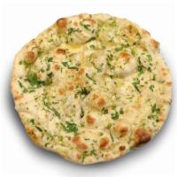 Garlic Naan · Our famous home made naan with an added layer of fresh garlic and cilantro, then baked in a ...