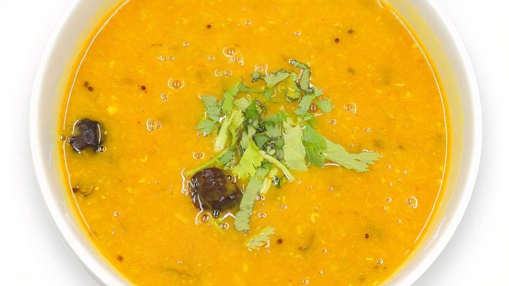 Khaati Daal Half (8 Oz) · Split red lentils made with tamarind and other rich ingredients made into tangy curry.