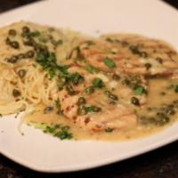 Chicken Piccata · Grilled chicken breast sauteed with capers, in a delicate lemon butter sauce served with ang...